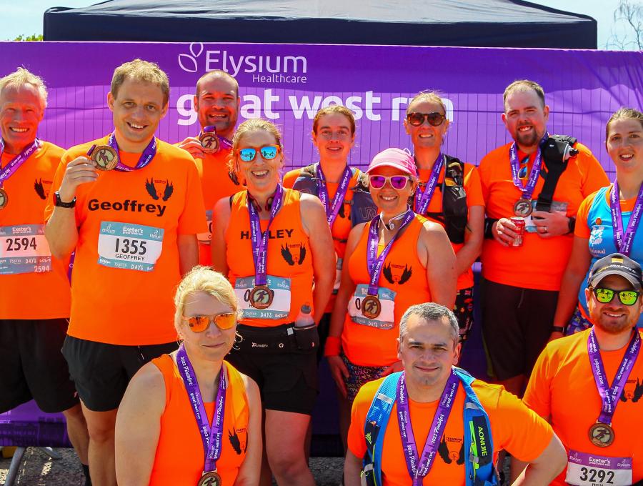 A group photo of the Cranbrook Running Club after the 2023 Exeter Great West Run
