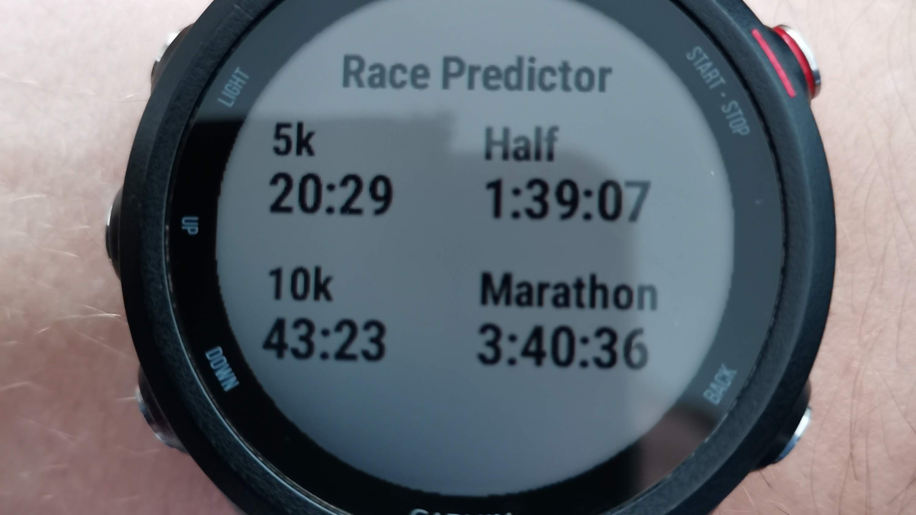 A photo of my Garmin watch race pridictor showing 20:29 for 5K.